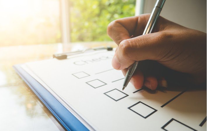 person using a furnace maintenance checklist